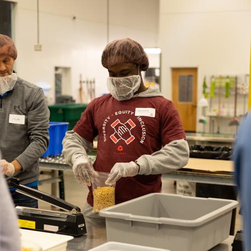 A person in the Volunteer Center packing