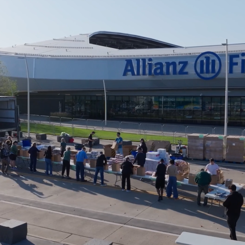 Hunger Action Month Event at Allianz Field Volunteers packing food boxes outside Allianz Field