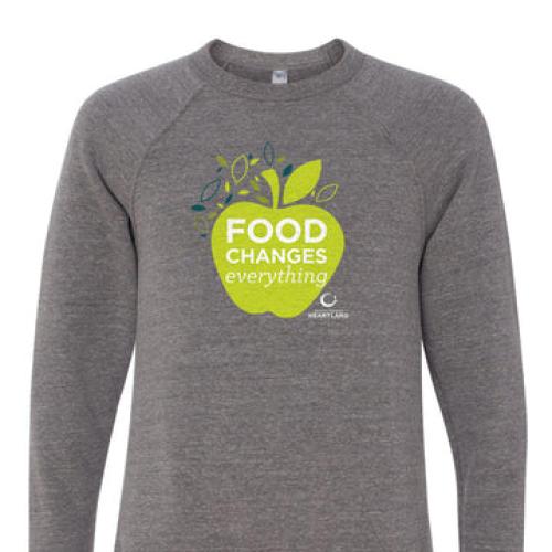 A gray sweatshirt with apple image and the words 'food changes everything' on it