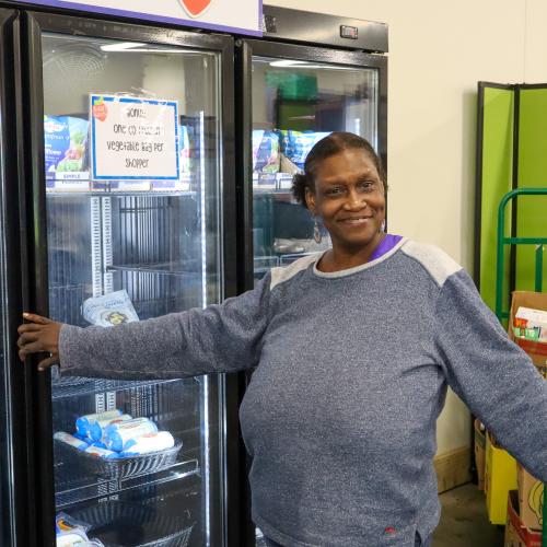 Woman in front of a cooler