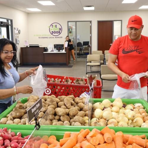 A couple shops for produce