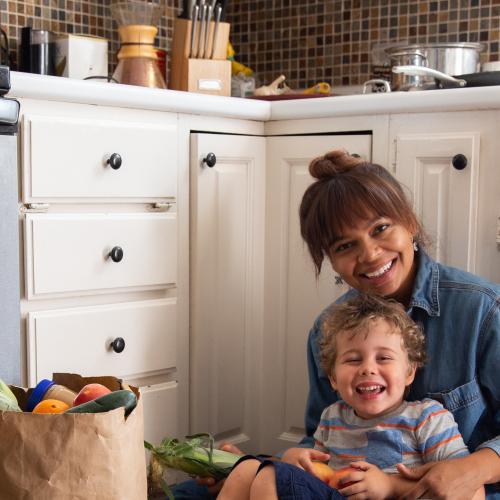 Person sitting on floor with child