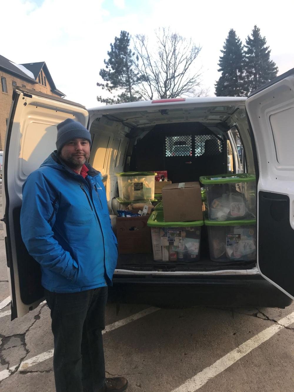 Big Lake Community Food Shelf volunteer prepares for a delivery