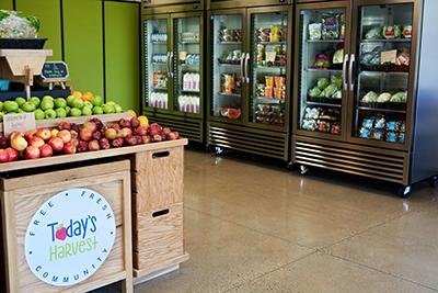 Food shelf with produce and coolers