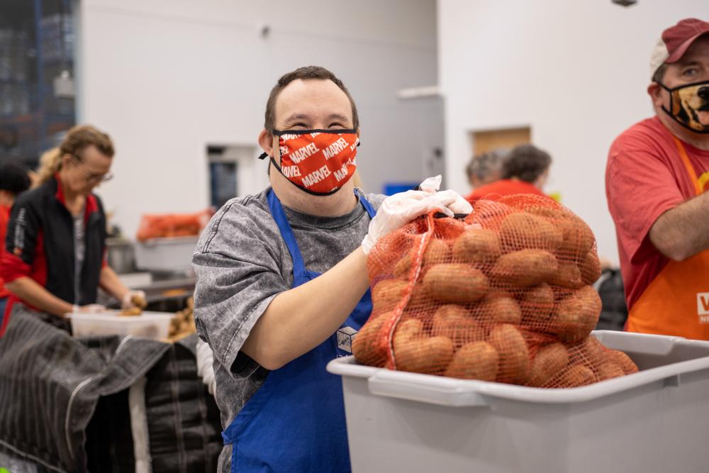 Volunteer packing potatoes