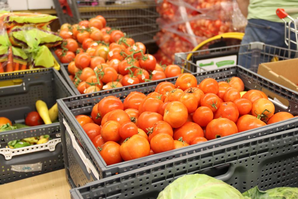 Red tomatoes in a bin