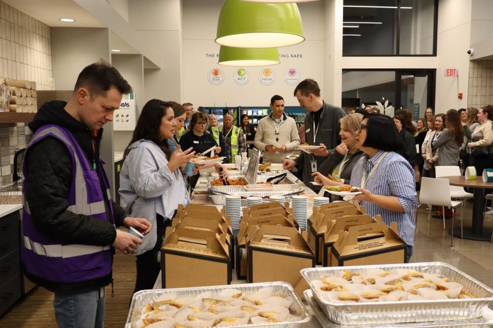 A group of Second Harvest Heartland employees gather for lunch