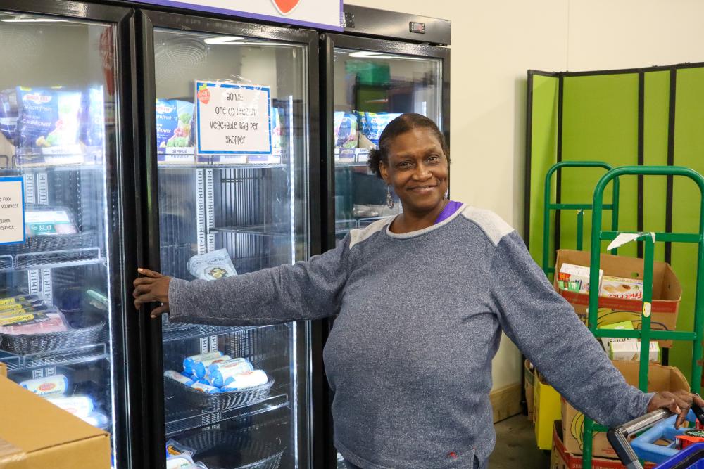 Woman in front of a cooler