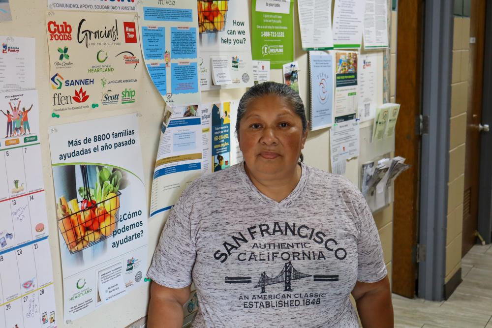 A woman standing in a food shelf