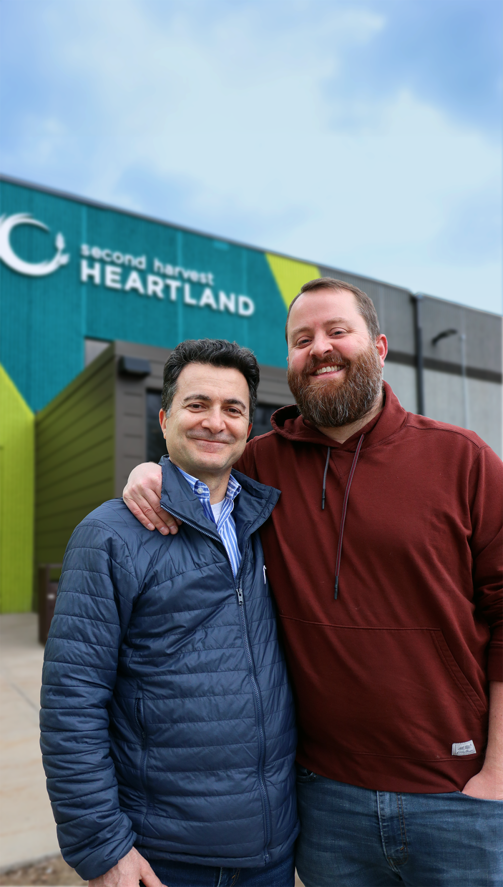 Two Second Harvest Heartland volunteers standing outside the Brooklyn Park facility