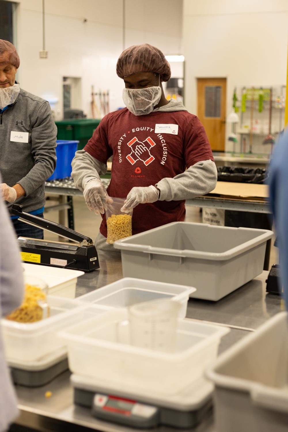 A volunteer packs food in our Volunteer Center