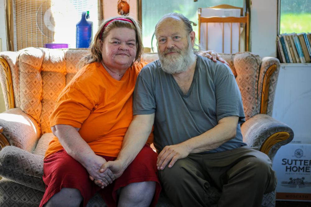 Two adults sitting on a couch