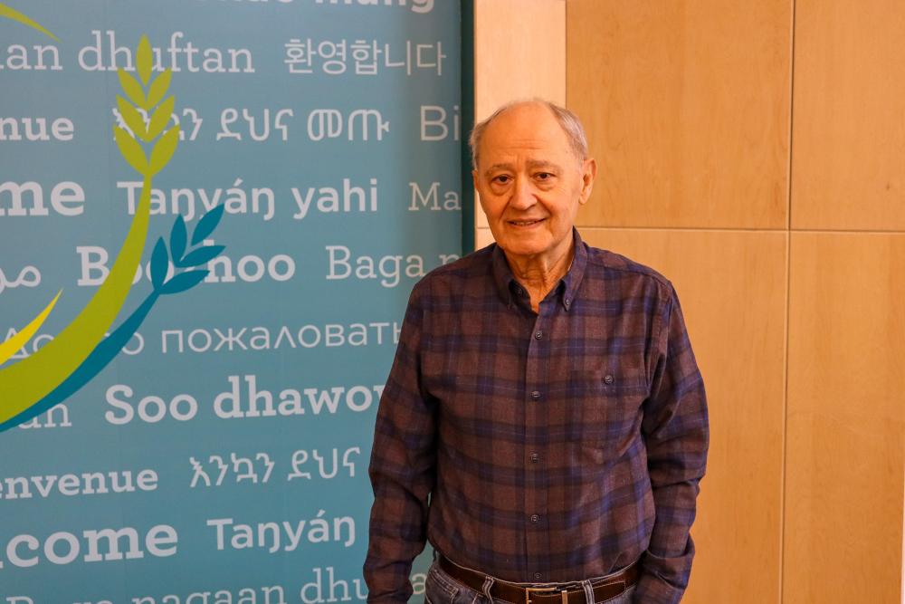 A volunteer stands in our Welcome Center