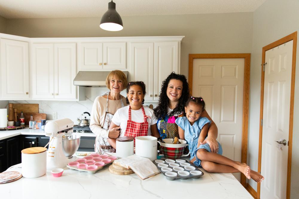 A family in a kitchen with baking supplies