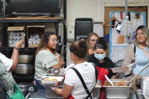 Conference Attendees tour Homi’s kitchen