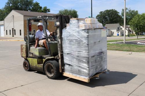 Volunteer, Marv, delivers pallets of food