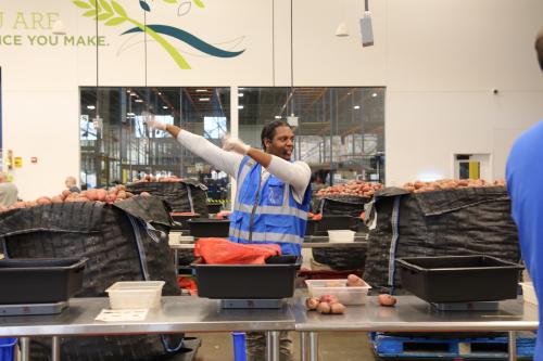 A Second Harvest Heartland employee gives directions to volunteers