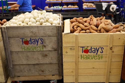 Wooden crates of potatoes and onions