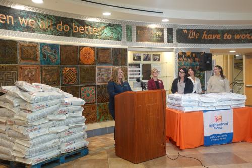 Lindsey Ochmanek and representatives from Animal Humane Society and Neighborhood House announcing the new partnership.